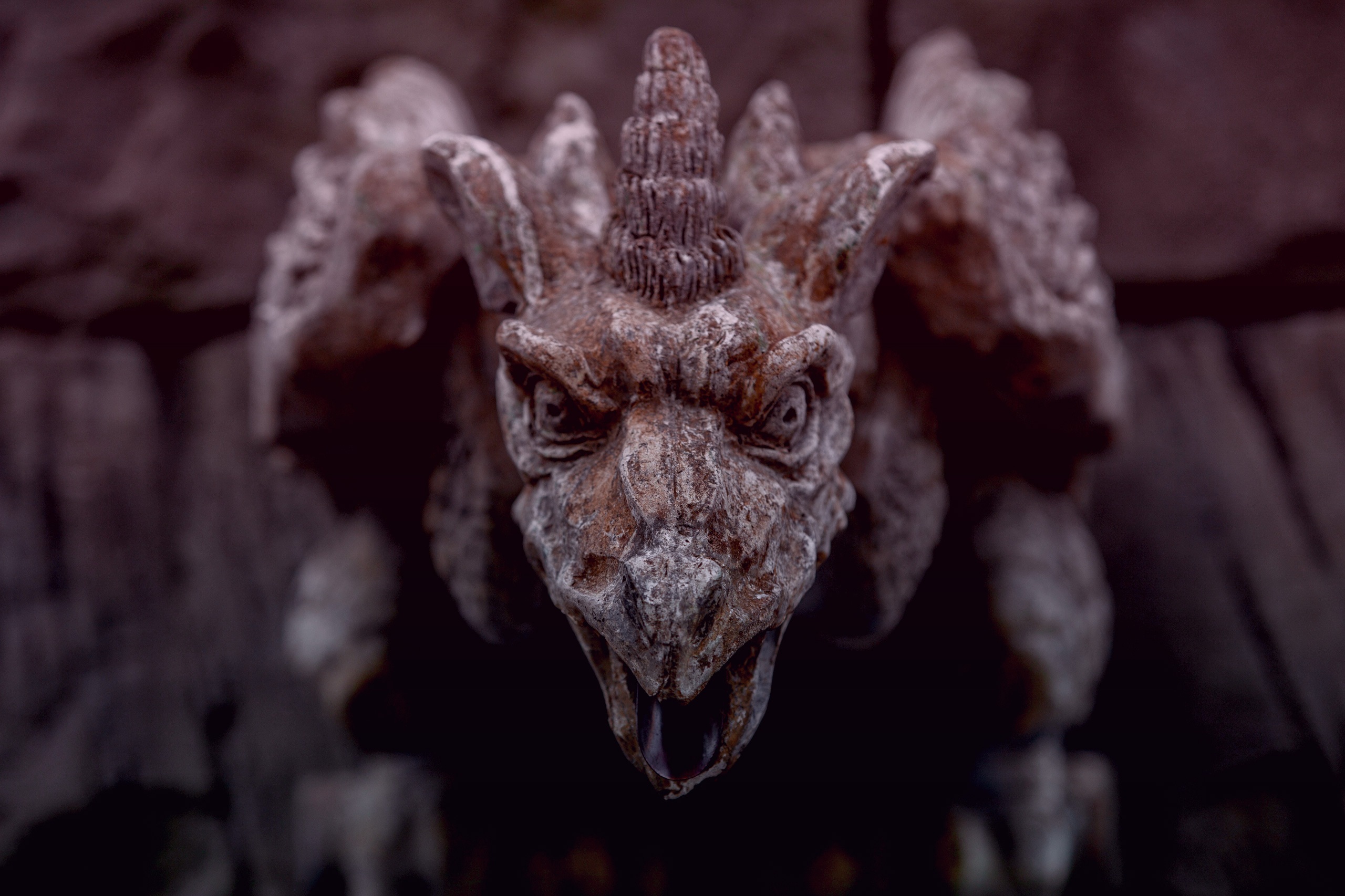 An image of a stone gargoyle on a building