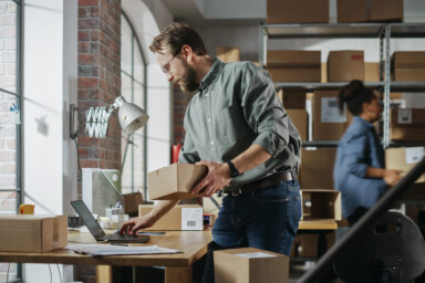 Man processing orders in a green shirt