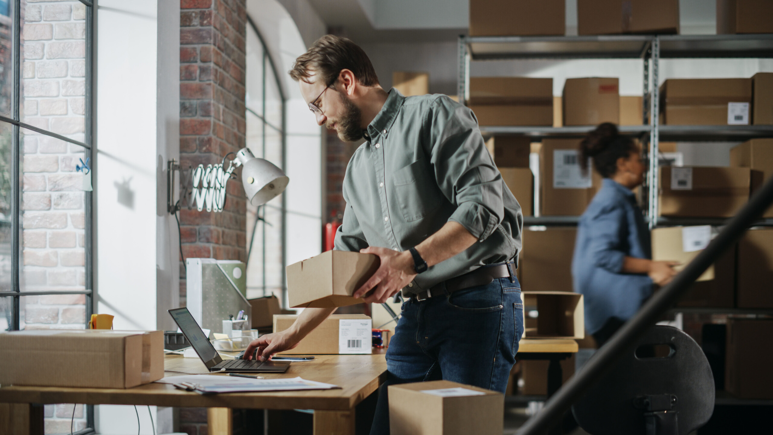 Man processing orders in a green shirt