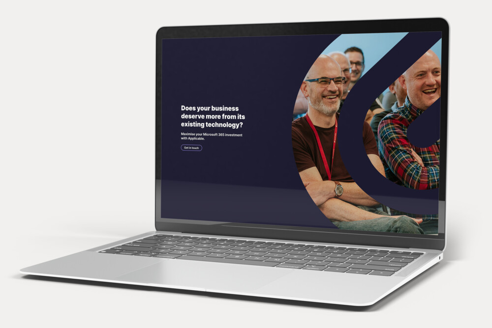 A laptop showing Applicable's website design