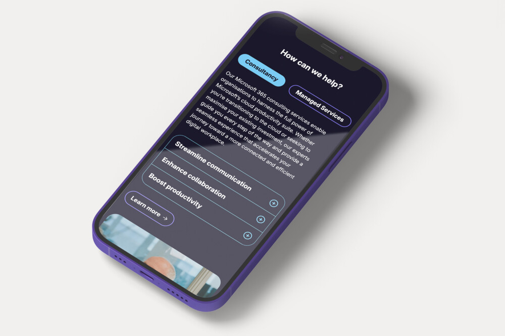 A phone showing Applicable's website design