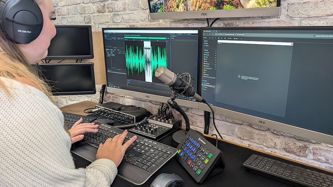 Abi editing a podcast at This is Fever's podcast studio in Colchester