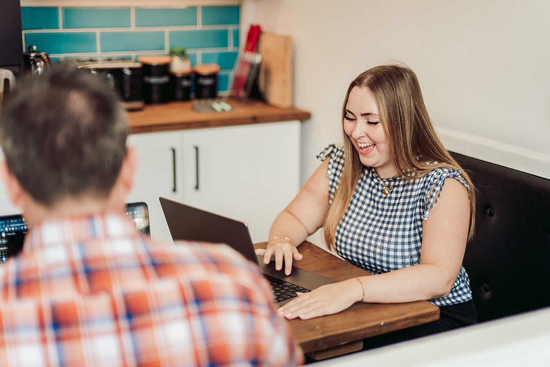 One of our retainer designer on laptop at a table