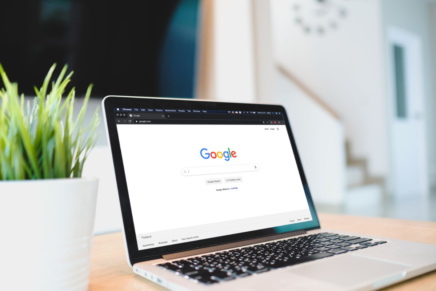 A laptop with the main Google search page open.