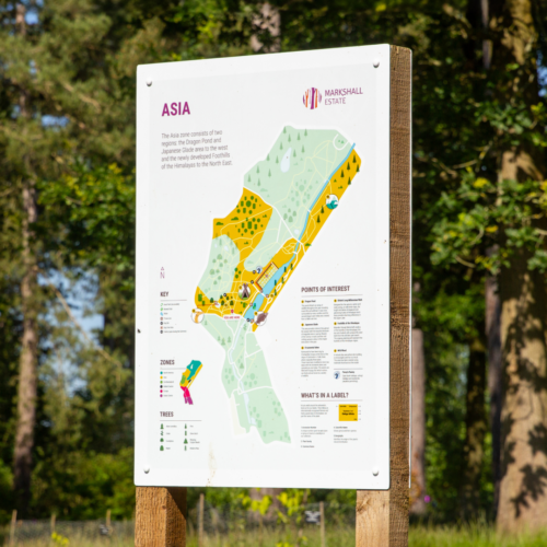 Markshall map signage installation in front of wooded area