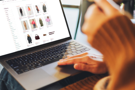 Out and About Ecommerce website on laptop screen